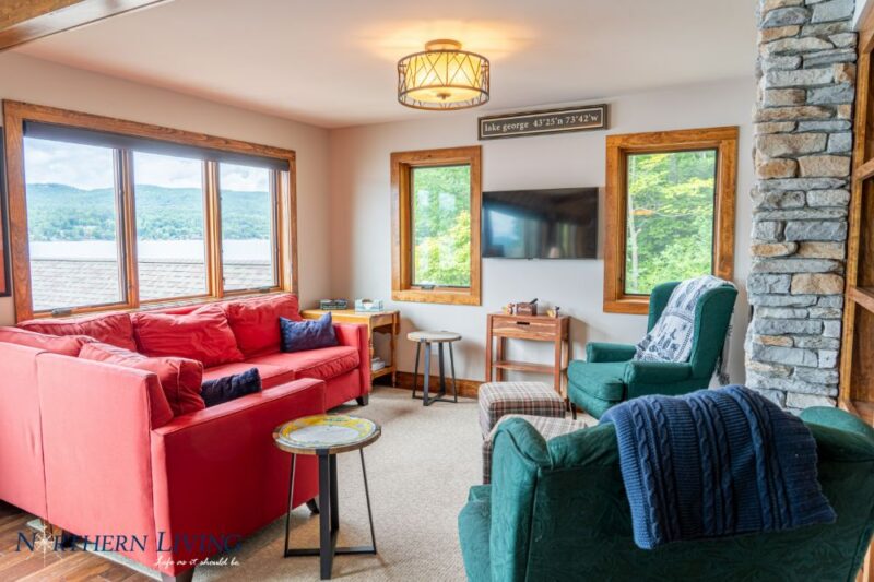 living room with red sectional sofa and wall-mounted television