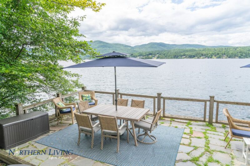 Patio furniture overlooking Lake George at French Mountain Cove vacation home rental