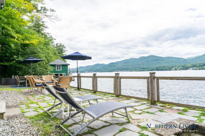 Chaise lounge chairs overlooking the lake at French Mountain Cove vacation home rental on Lake George