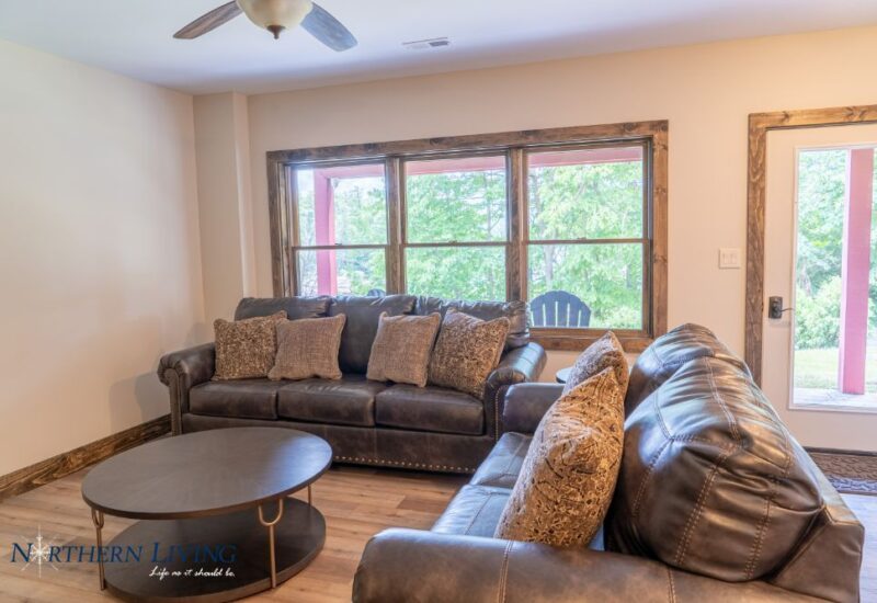 leather sofas abd coffee table inside Island Overlook vacation rental in Lake George