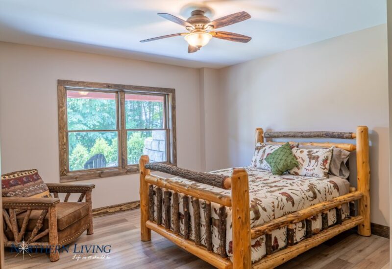 Bedroom with rustic Adirondack decor in Island Overlook vacation rental