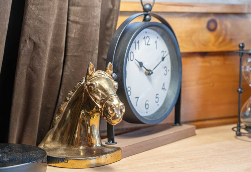 brass horse head knick knack with clock